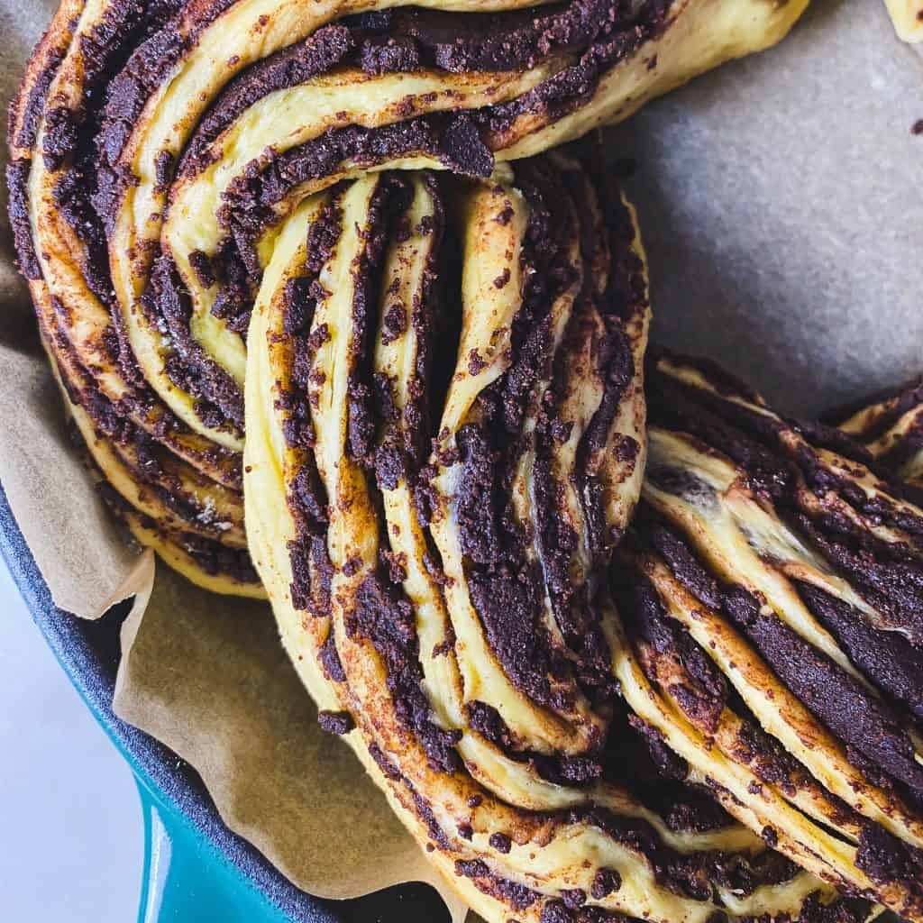Close up view of the swirls and layers in a chocolate pumpkin babka.