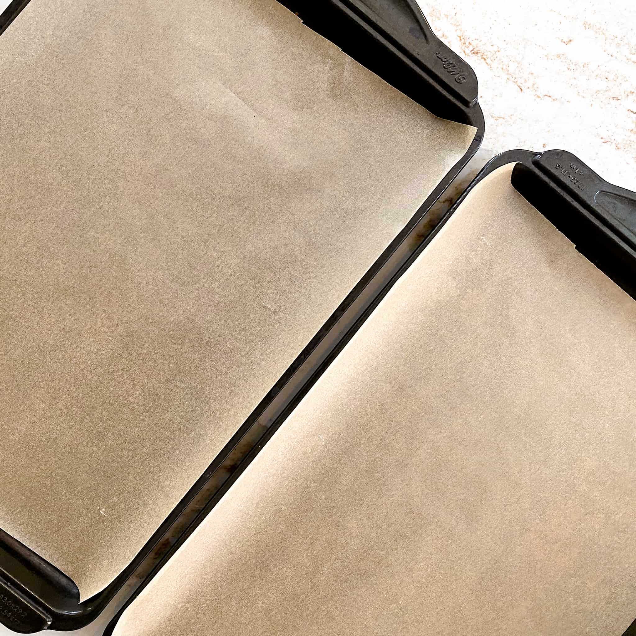 Cookie sheets lined with parchment paper.