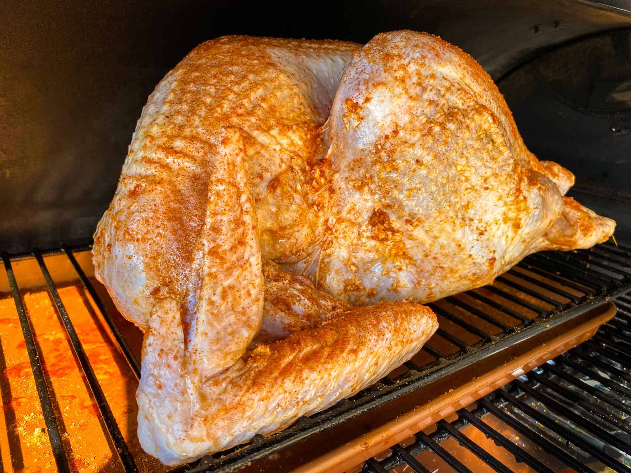 Whole turkey on a traeger ready to be smoked.