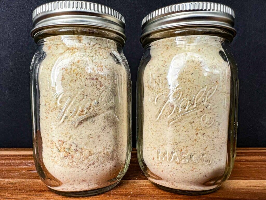 Garlic powder in two mini mason spice jars.