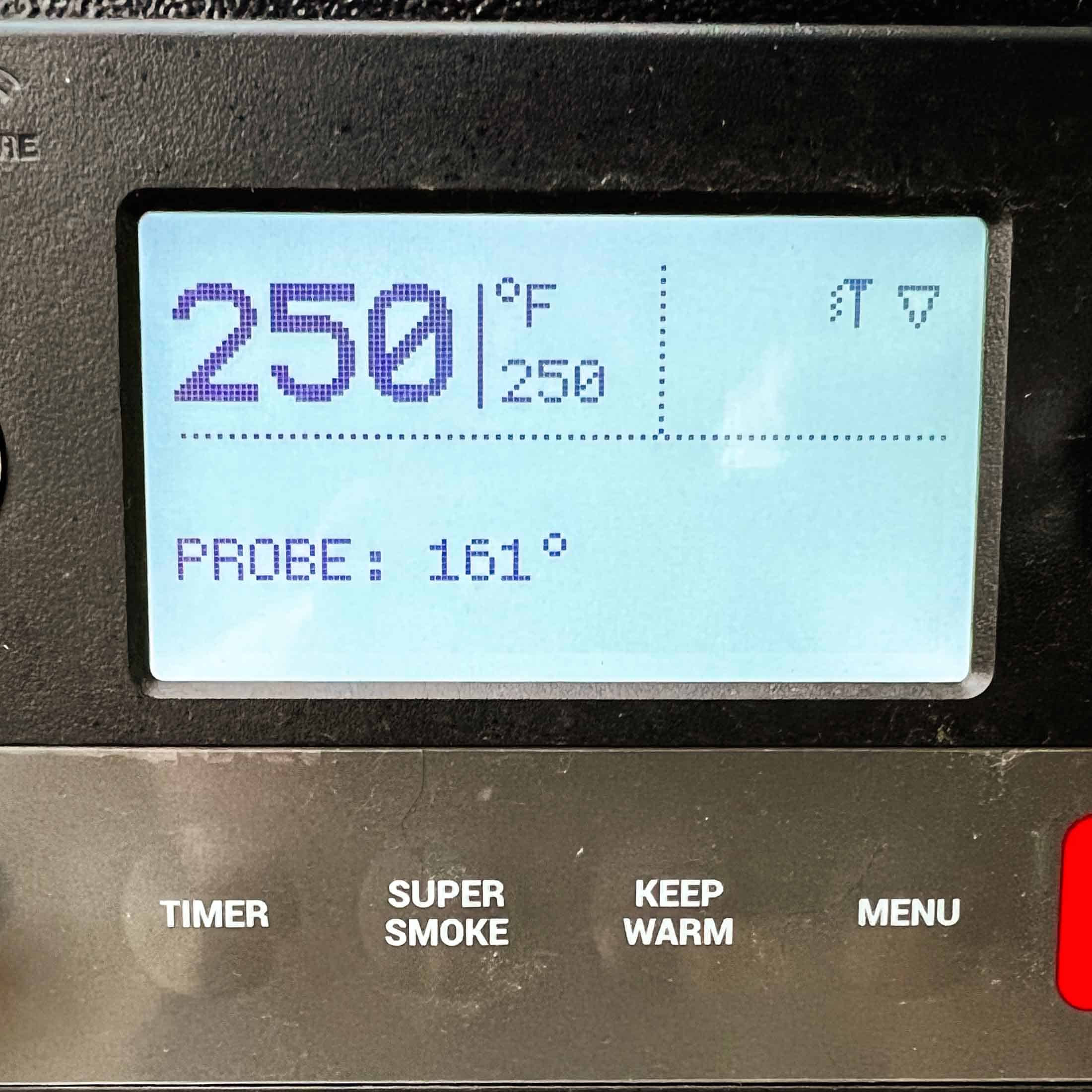 Traeger display screen showing a set temperature of 250 degrees f and internal temp of 161°F.