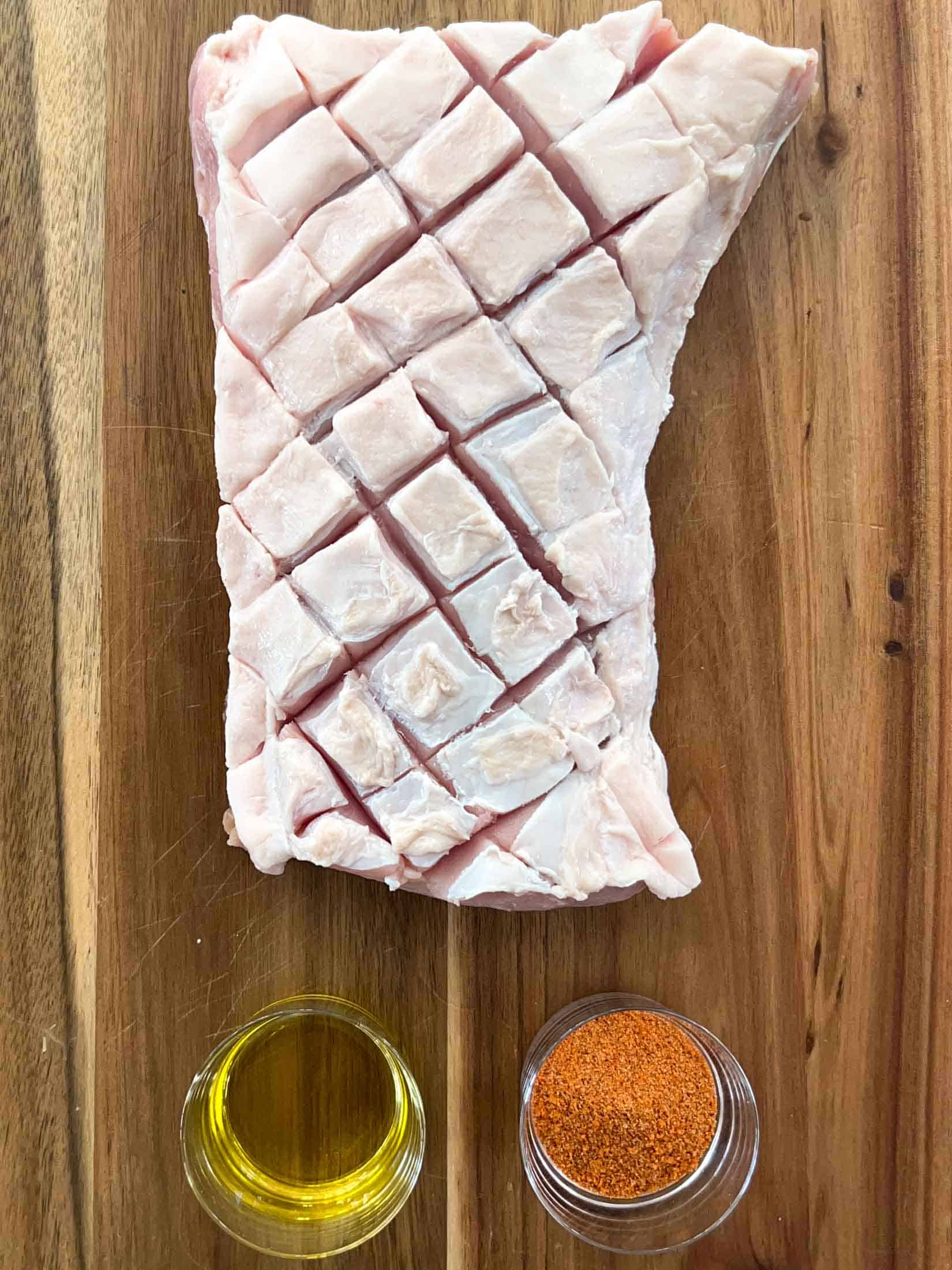 Key ingredients for pork loin roast including a 3 pound roast, olive oil, and pork rub.