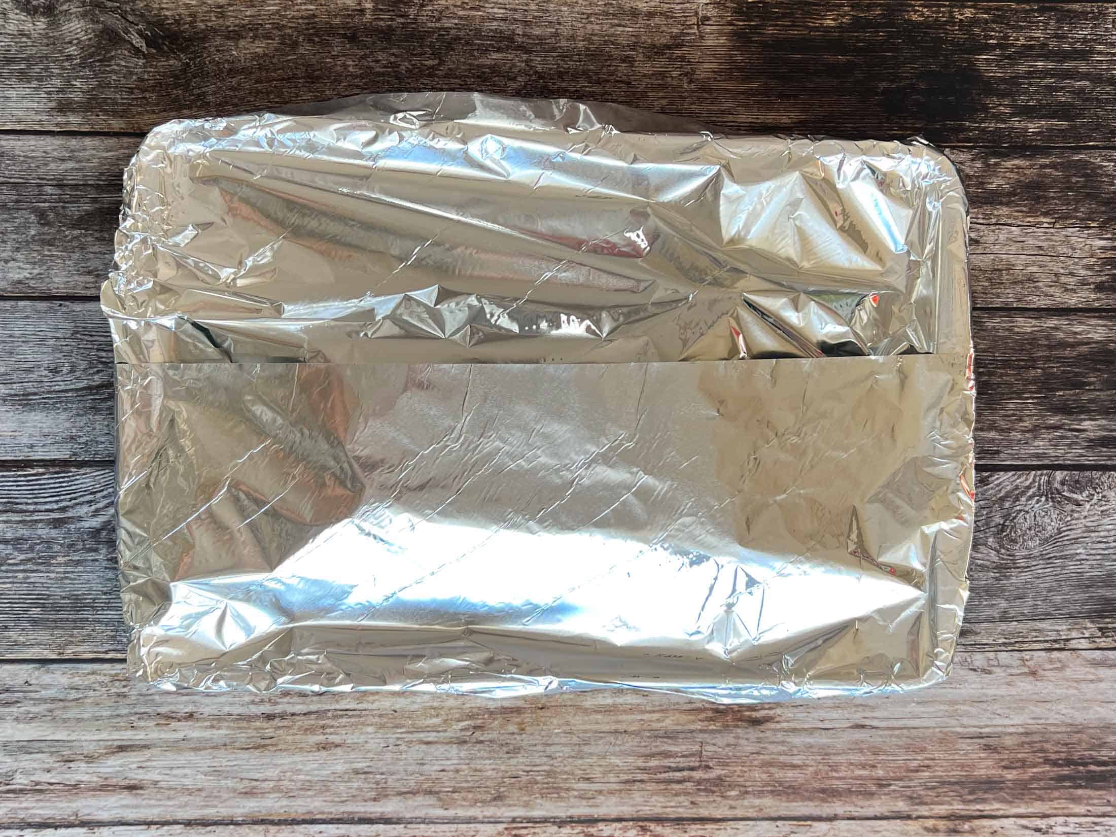 Traeger pork loin roast covered in foil to rest.