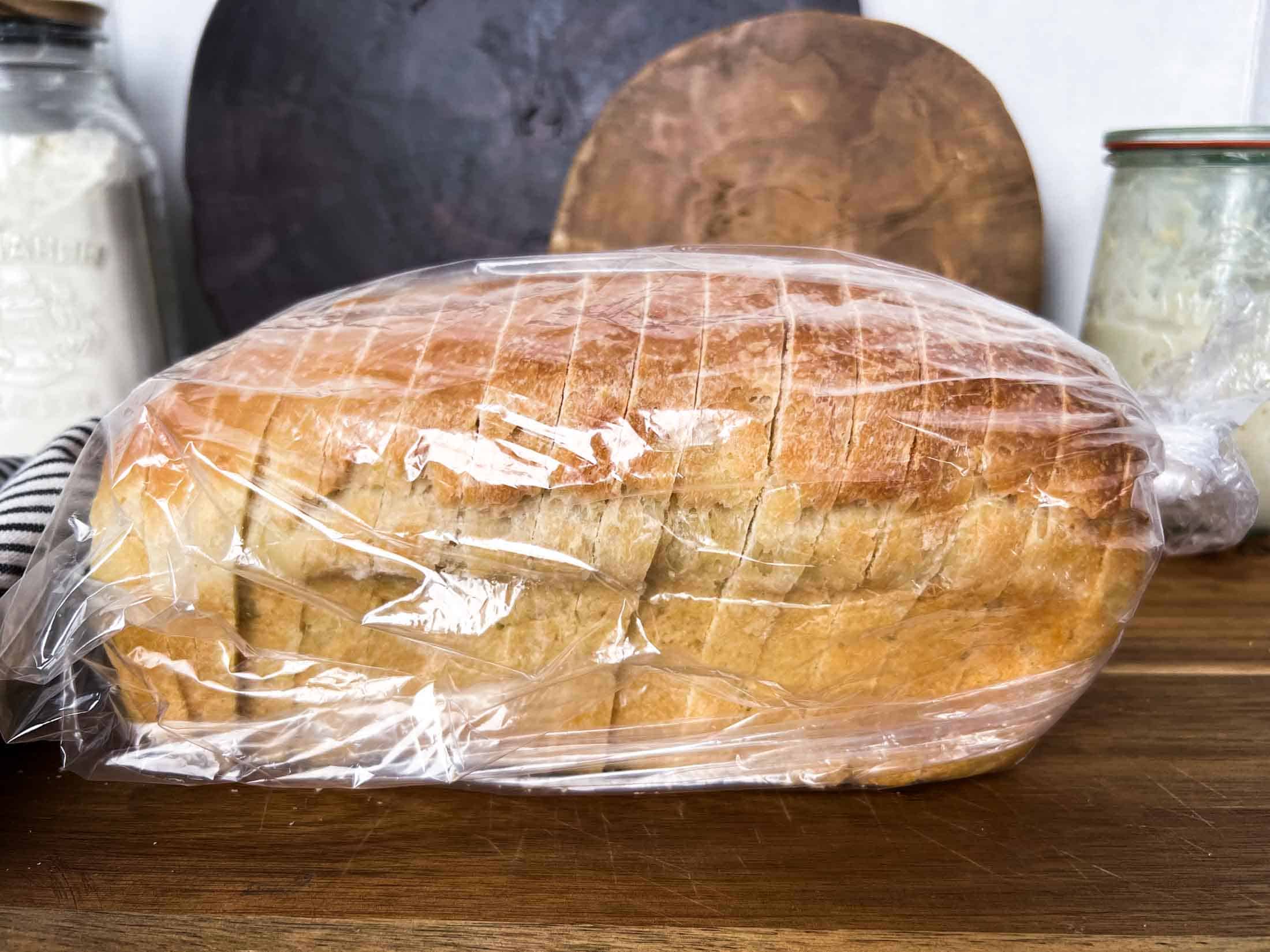 Sourdough sandwich loaf sliced and placed in a plastic bag.