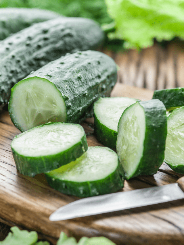 Cucumbers chopped on a wooden cutting board. 