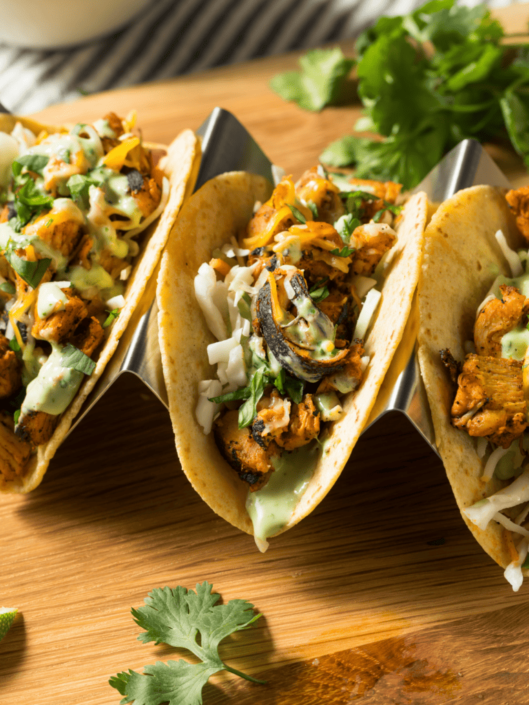 Chicken tacos with cilantro and lime sauce.