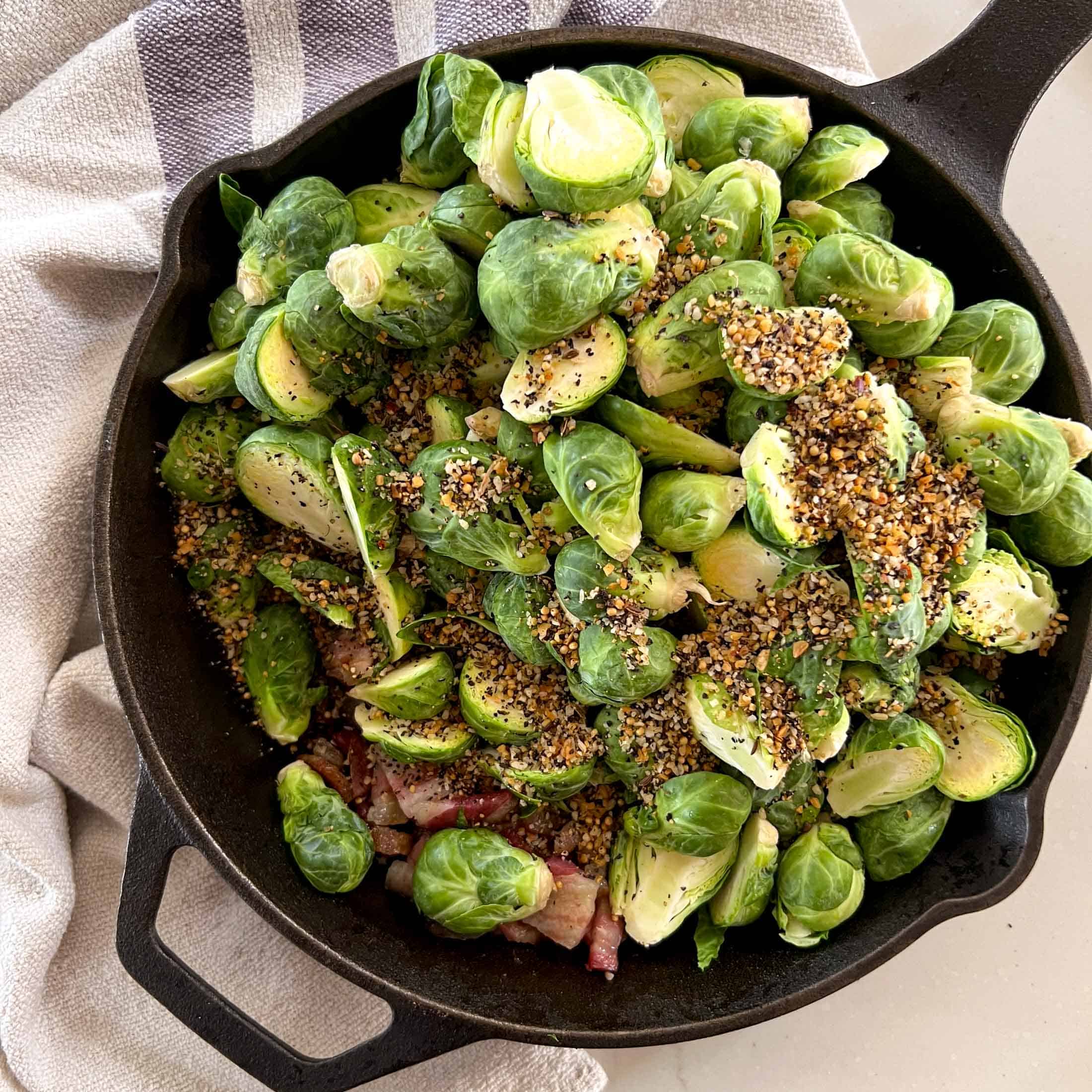 Montreal steak spice on top of raw brussels sprouts.