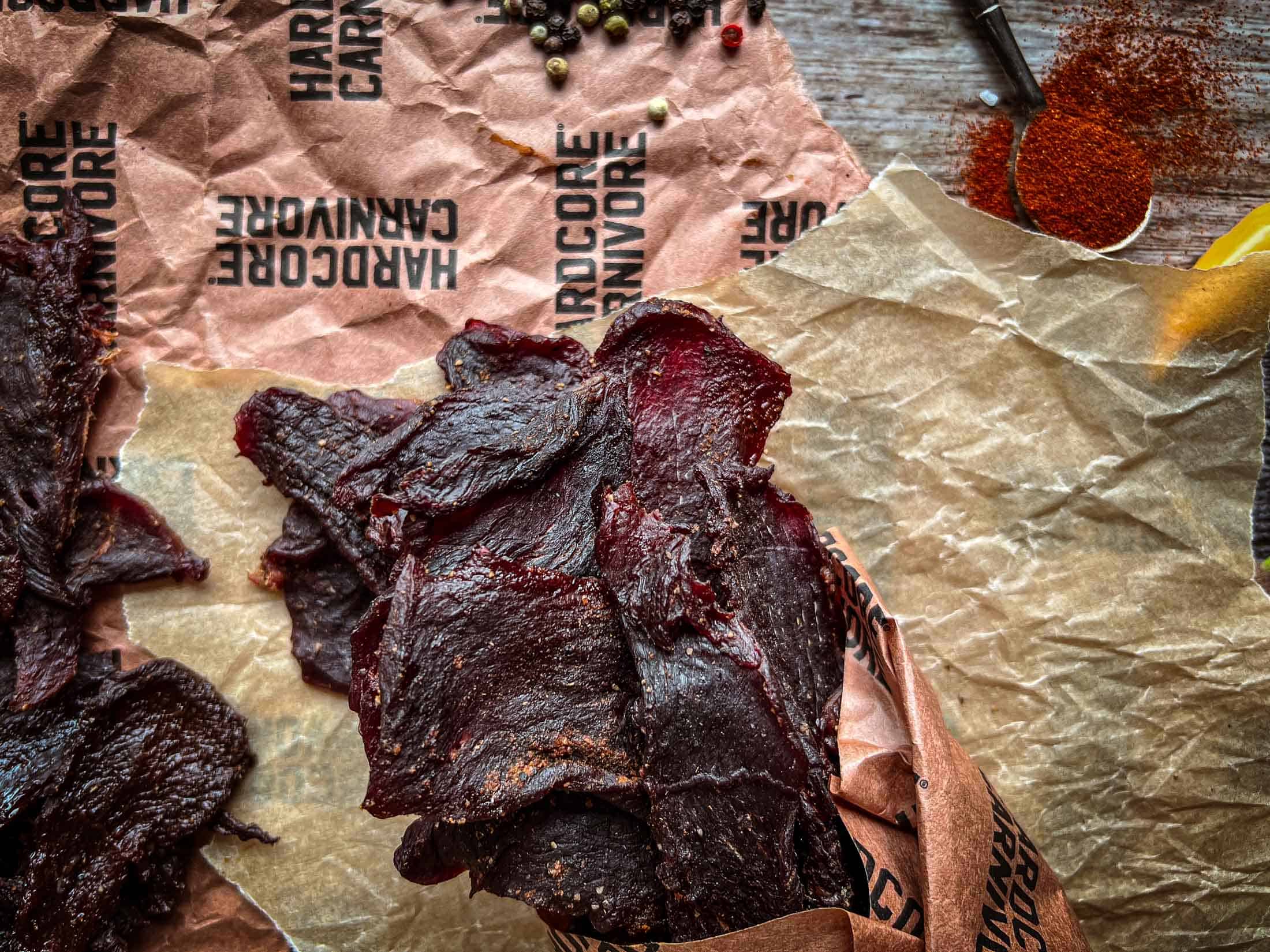 Venison jerky wrapped in butcher paper.